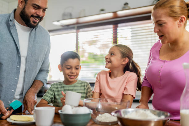 istock Family cooking at kitchen 2153401007