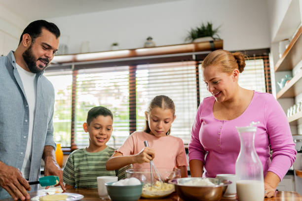 istock Family cooking at kitchen 2153401038