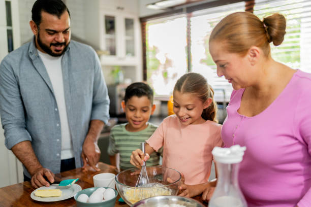 istock Family cooking at kitchen 2153401061