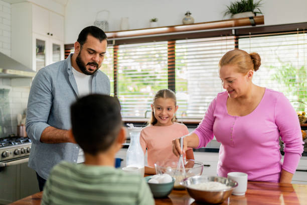 istock Family cooking at kitchen 2153401101