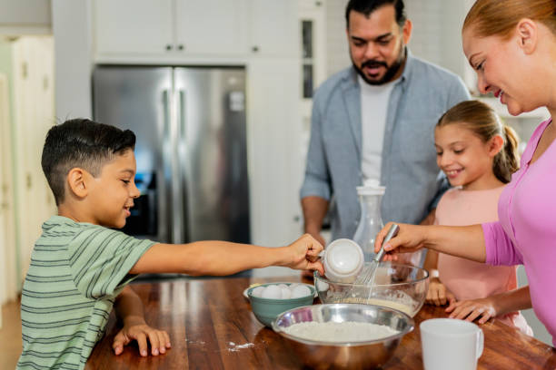 istock Family cooking at kitchen 2153401120