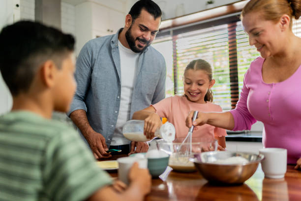istock Family cooking at kitchen 2153401142