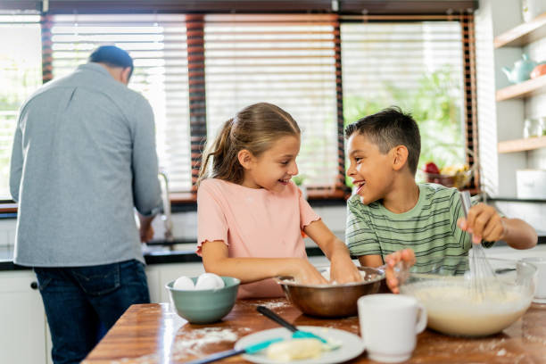 istock Child siblings talking and cooking at home 2153401268