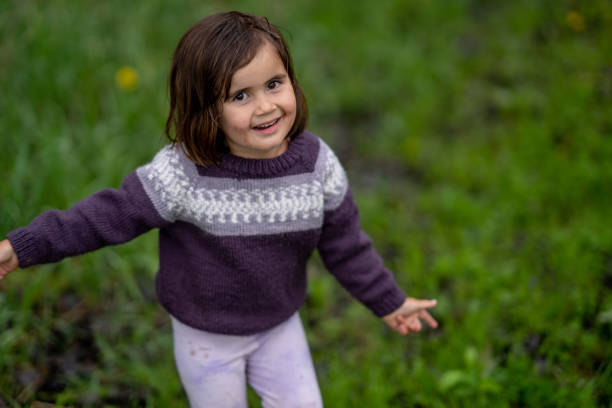 istock Little Girl Playing Outside 2153404041