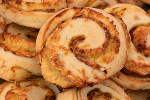 Fresh baked cheese buns of bread close up full frame close up