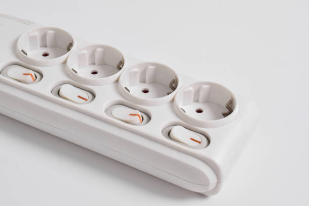 istock White Electrical plug in outlet socket at home isolated on white background 2153406380