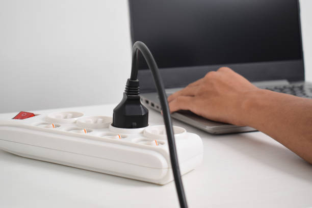 istock Electrical plug in outlet socket at home. Outlet, Electric Plug, Power Cable, Electrical equipment 2153408127