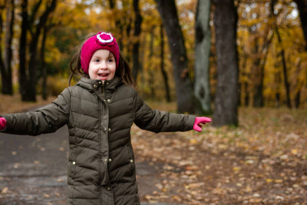 istock Girl enjoying in autumn park 2153411407