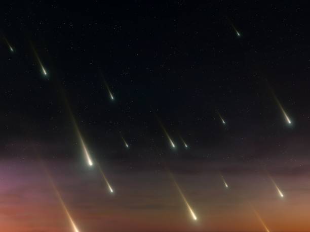 istock Star rain on a dark background. Many shooting stars at dusk. 2153414453