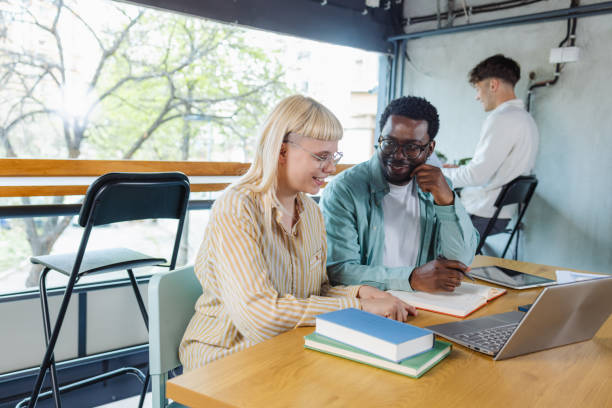 istock Young people working together on laptop in co-working space 2153415808