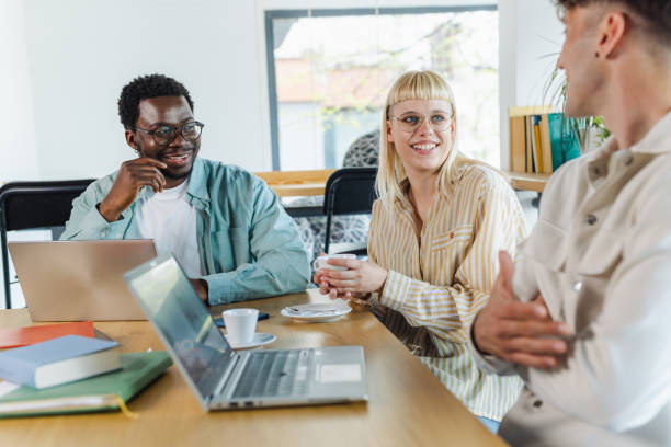 istock Diverse group of people working together and discussing business project 2153416860