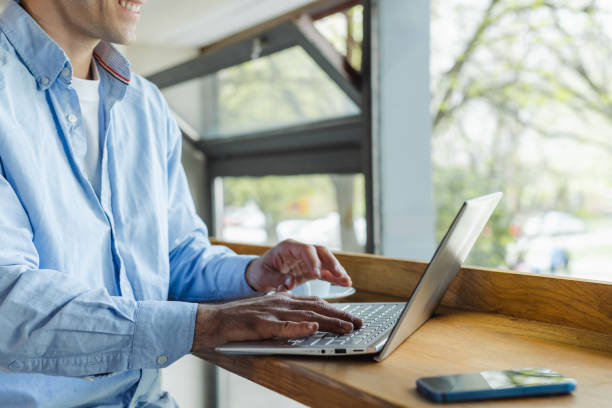 istock Young man working on laptop in a co-working space 2153417944