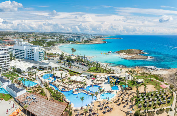 Nissi, Cyprus - April 08, 2024: Discover the pristine Nissi Beach in Cyprus, a paradise with white sands and turquoise waters, perfect for relaxation, water sports, and family holidays