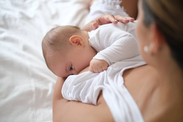 istock Unrecognizable Mother Breastfeeding Newborn Baby 2153419982