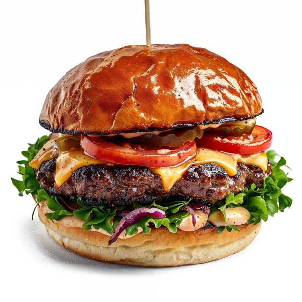Close-up of a juicy and mouth-watering gourmet burger featuring a glossy artisan bun, grilled beef patty, melted cheese, fresh tomato slices, crisp lettuce, red onion, and a delicious special sauce. Perfect for content related to gastronomy, restaurant menus, fast food promotions, and culinary blogs.