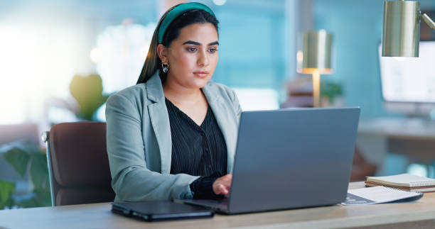 istock Typing, business and woman with laptop, thinking and problem solving with connection, internet and planning ideas. Research, networking and girl with computer, website admin and consulting with email 2153421283