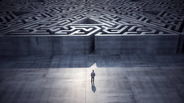 Businessman heading towards triangle shaped maze, Success Concept