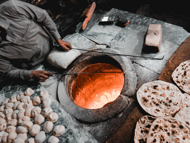 istock Preparing the naan bread clay oven 2153422715
