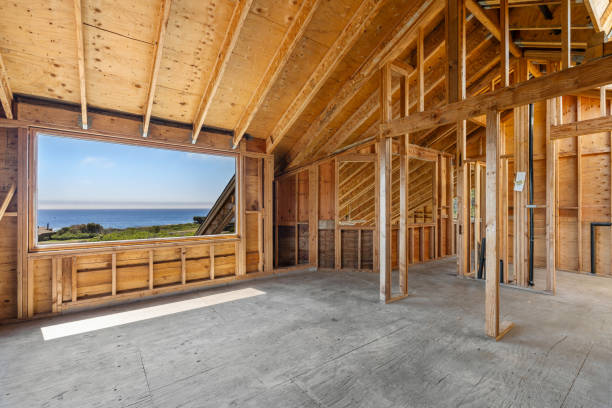 istock Home interior with wood framing under construction and ocean view 2153424678