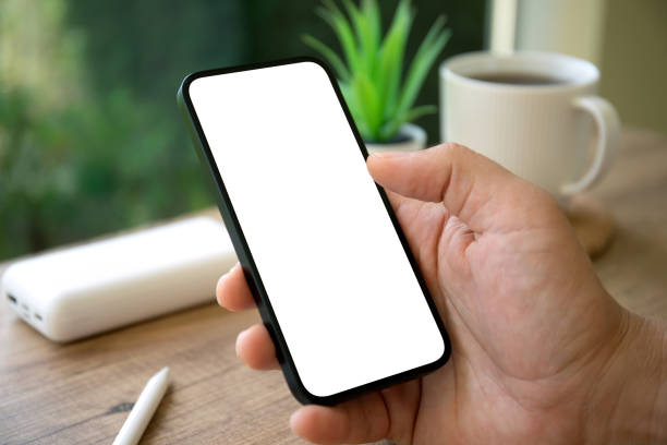 istock male hands holding phone with isolated screen background cafe office 2153426782