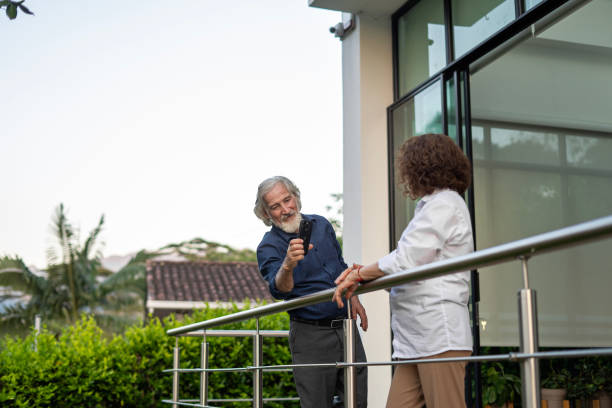 istock Mature man using cell phone at home. 2153427161