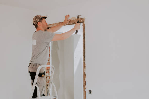 istock A young Caucasian male builder clears a doorway using a crowbar. 2153428652