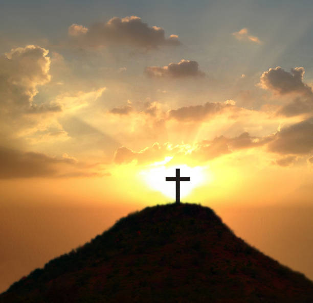 istock Cross against the sky . Dramatic nature background . Light from sky 2153433640