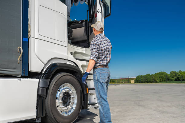 istock Caucasian Semi Truck Driver Preparing to Work 2153435491