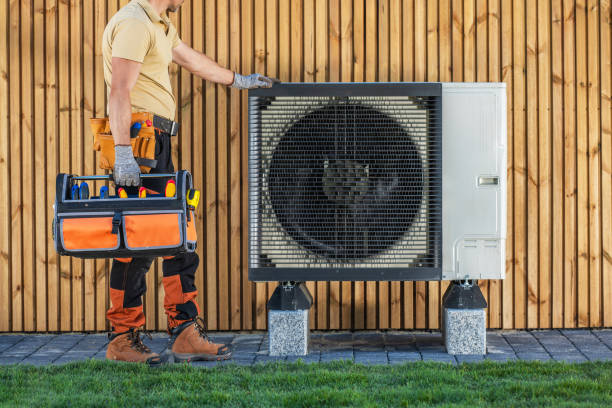 istock HVAC Technician Standing by Air Conditioning Unit Preparing For Maintenance. 2153436926