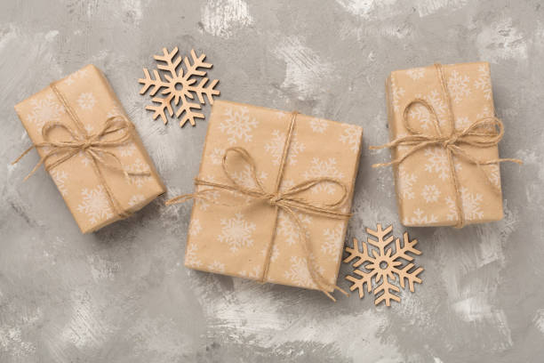 istock Craft christmas gift boxes on concrete background, top view 2153445133