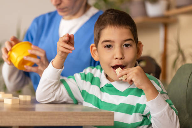 istock Alphabet Board Therapy with Nurse and Boy 2153445822
