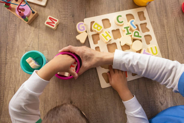 istock Alphabet Board Exercises for Autistic Boy 2153445846