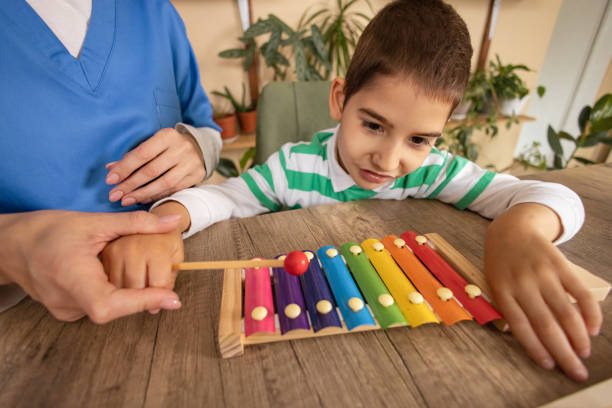istock Nurse Provides Music Therapy 2153446467