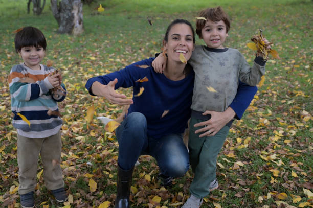 istock mother enjoying autumn with her children 2153446626