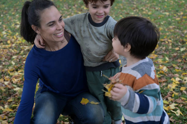 istock mother enjoying autumn with her children 2153446670