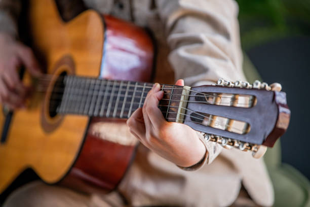 istock A person is playing a guitar. 2153447190