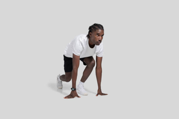 istock Ready to run man in athletic pose on white background 2153447898
