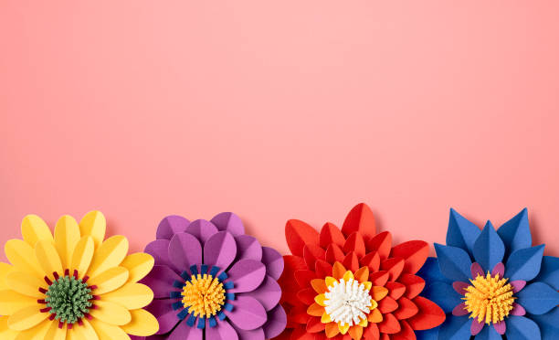 istock Handmade colorful paper flowers on pink background 2153452270
