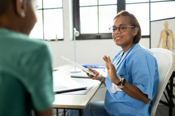istock Latin pediatrician advising her little patient 2153459416