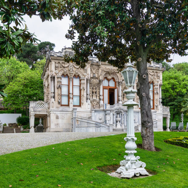 The elegant Ihlamur Pavilion, framed by manicured gardens and lush trees in Istanbuls Nisantasi district