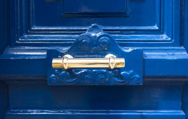 istock Paris, France: Old Blue Door With Ornate Gold Knob 2153463328