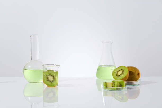 istock Various types of laboratory glassware featured on white background with kiwi ingredients, photo for advertise healthcare or beauty care product extracted from kiwi. Front view, space for text 2153465331