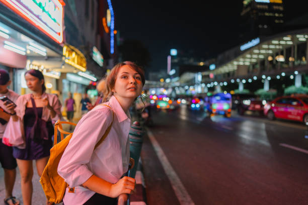 istock Woman exploring in Bangkok at night 2153465465