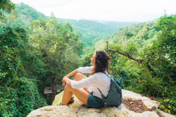 istock Woman sitting on viewpoint overlooking jungles on Koh Samui 2153465602