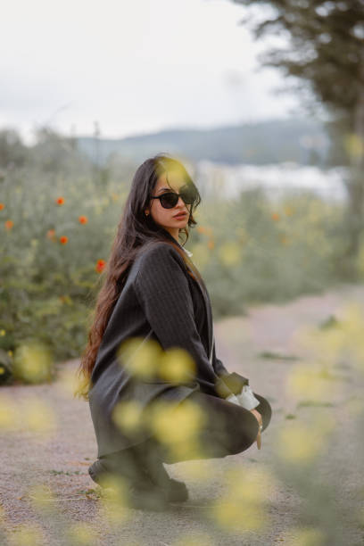 istock beautiful woman posing crouching 2153466302