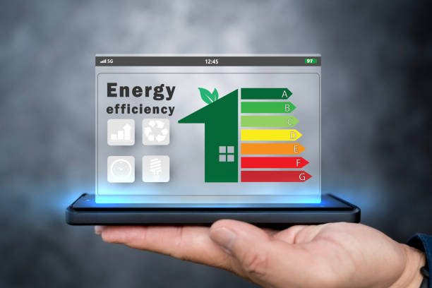 istock Energy efficiency concept. Person holding energy efficiency rating icon. 2153466890