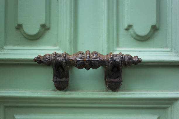 istock Paris, France: Ornate Antique Door Pull, Old Green Door Close-Up 2153467429