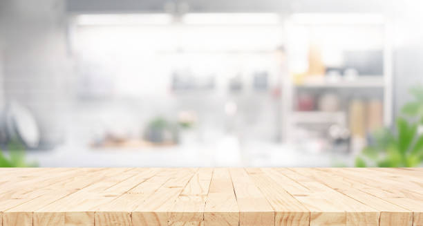 istock Selective focus.End grain wood counter,table top on blur kitchen counter in morning background.For montage product display o 2153468671