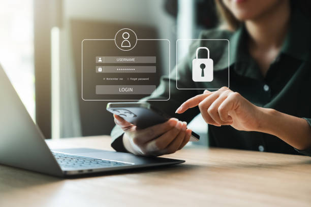 istock businesswoman is using a smartphone and pointing at a screen that has a lock icon on it 2153471769