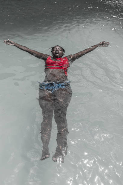 A young woman swims in the pool. Thursday, May 16, 2024, Delmas, Haiti